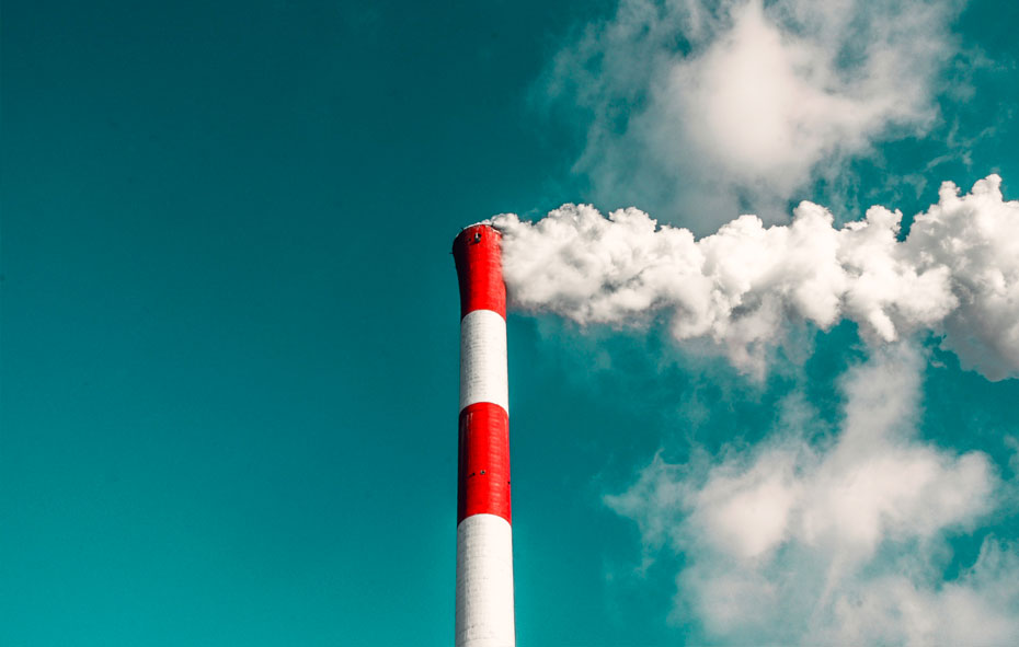 this is an image of an industrial chimney smoking